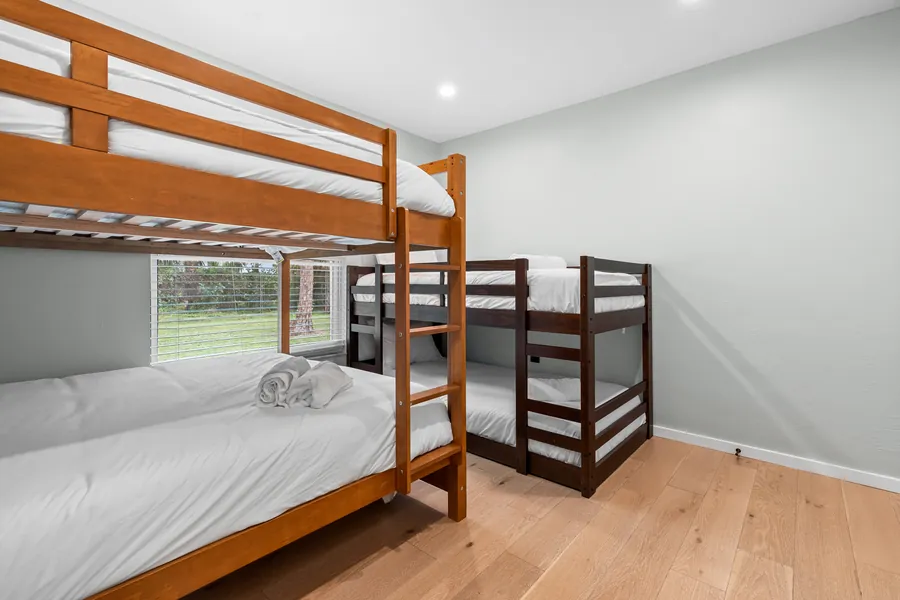 Bunk room with two twin-over-twin wooden bunk beds for the kids, The Naples Retreat, Naples FL