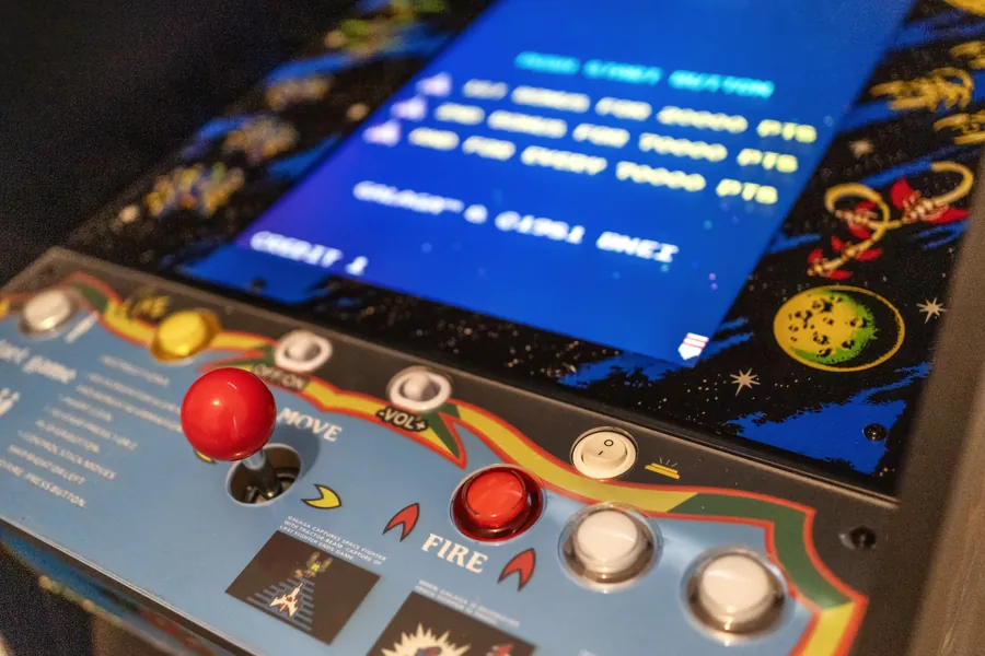 Close-up of the retro arcade cabinet controls in the game room, The Naples Retreat, Naples FL