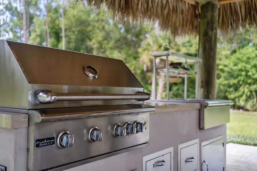 Stainless built-in gas grill in the tiki outdoor kitchen, The Naples Retreat, Naples FL